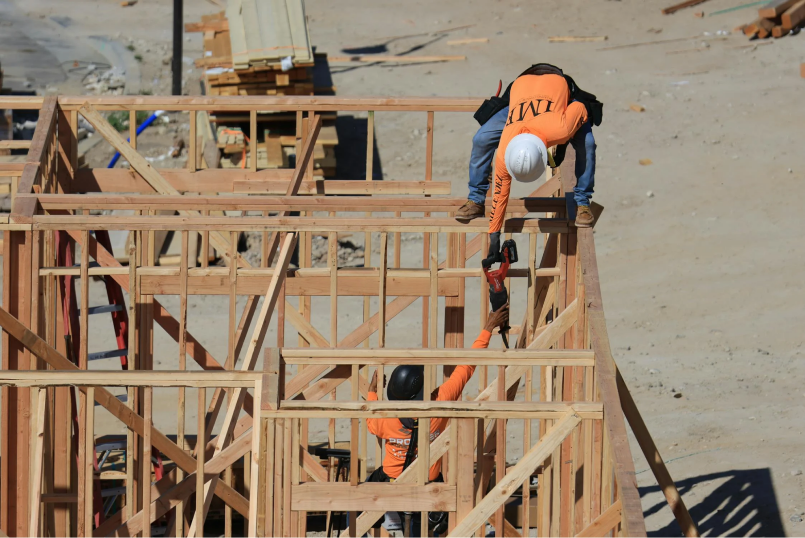 Workers working on a load bearing wall